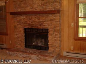 27 Ferndale Road Maggie Valley, NC 28751 - Photo 5 of 8 a stone house with a fireplace