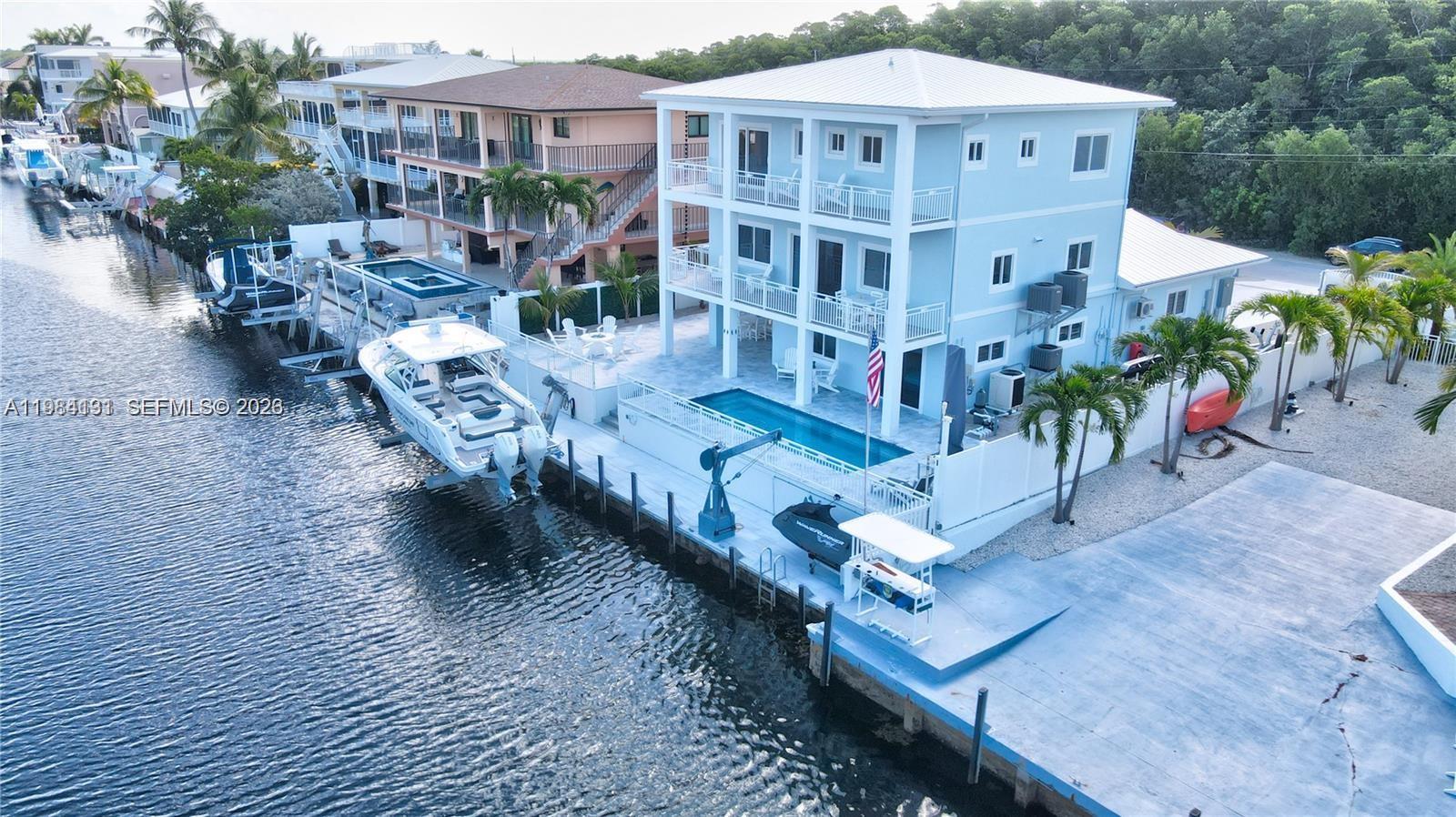 48 Andros Road Key Largo, FL 33037 - Photo 13 of 59 a view of a building with wooden floor