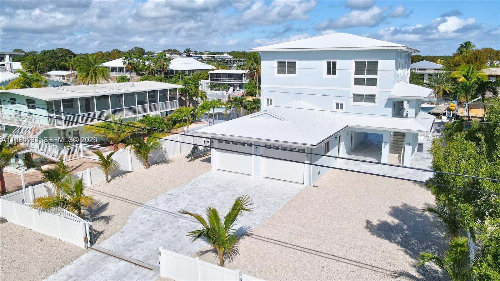 48 Andros Road Key Largo, FL 33037 - Photo 3 of 59 a view of a house with a patio