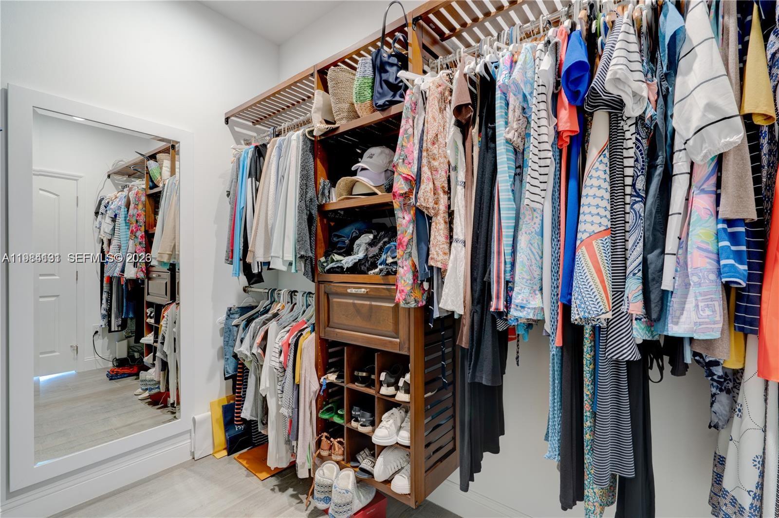 48 Andros Road Key Largo, FL 33037 - Photo 39 of 59 a view of walk in closet with clothes and shoes