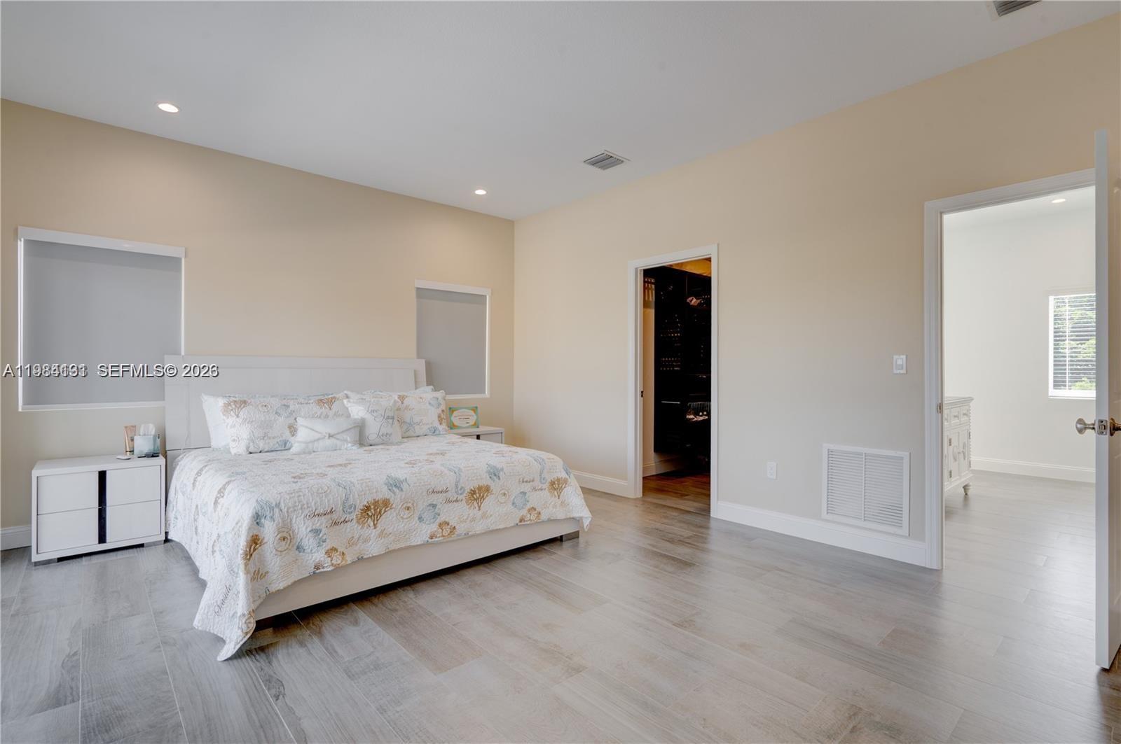 48 Andros Road Key Largo, FL 33037 - Photo 44 of 59 a bedroom with a bed and a lamp