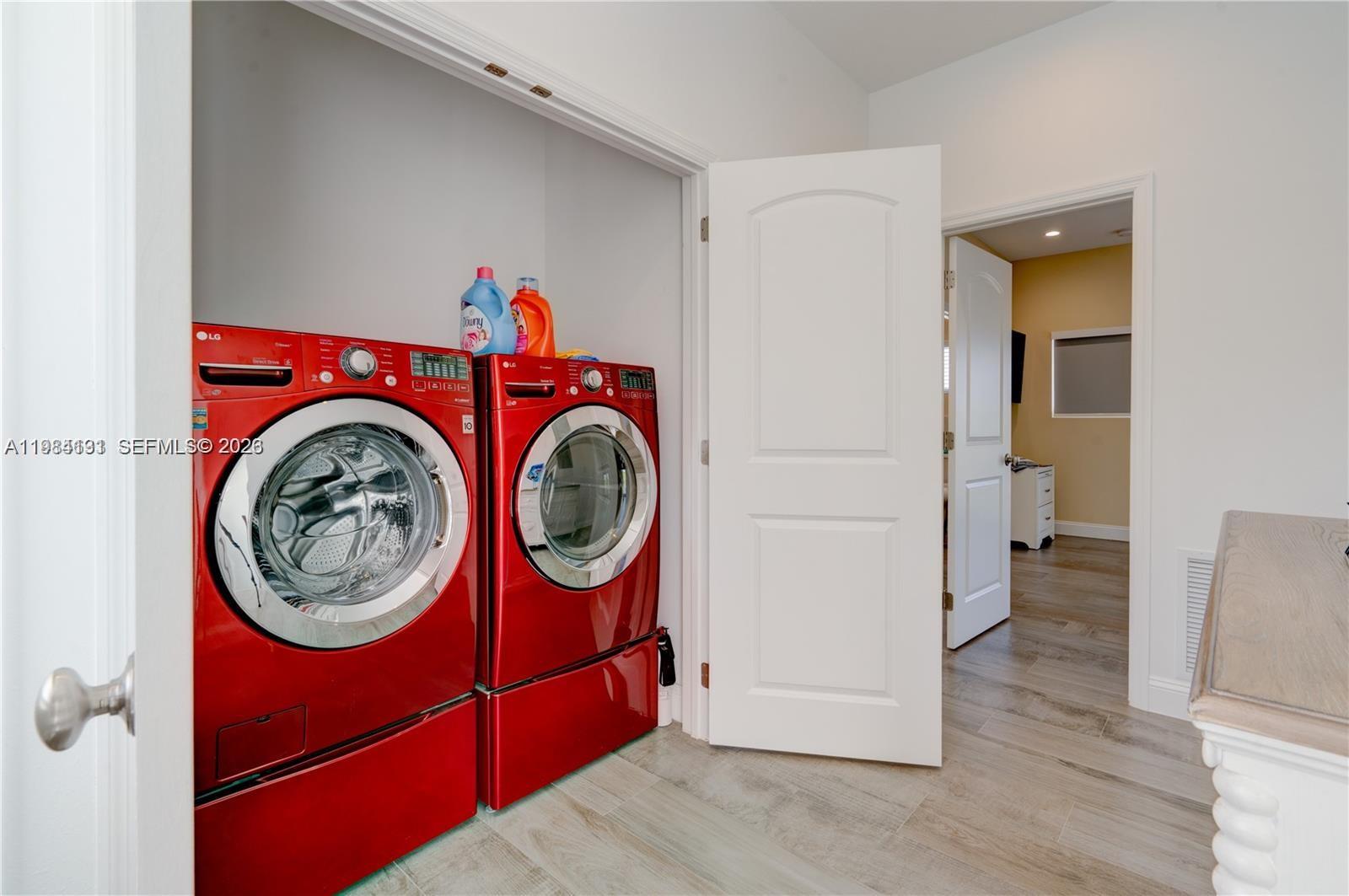 48 Andros Road Key Largo, FL 33037 - Photo 45 of 59 a view of a hallway with washer and dryer