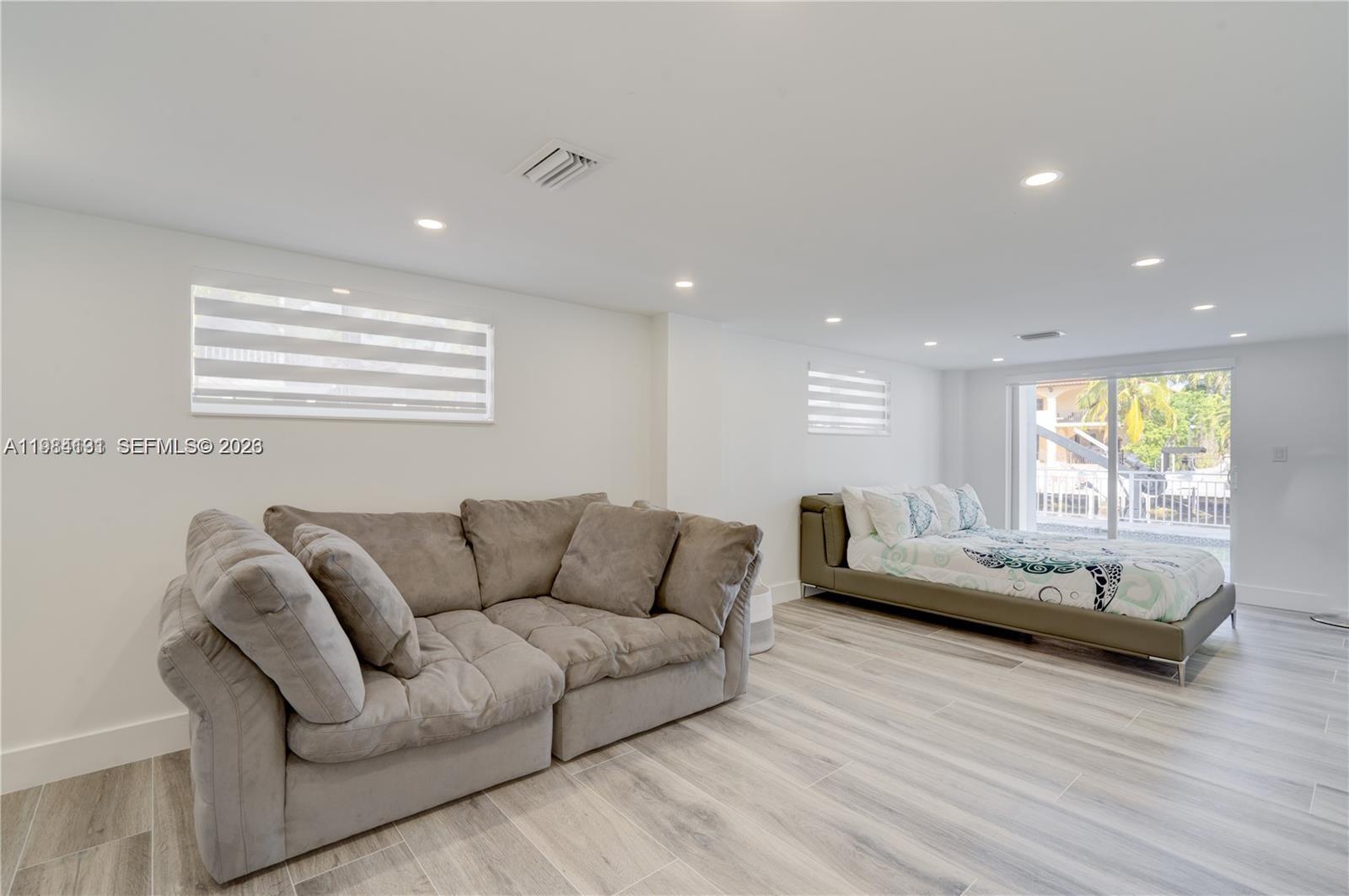 48 Andros Road Key Largo, FL 33037 - Photo 55 of 59 a living room with furniture and a large window
