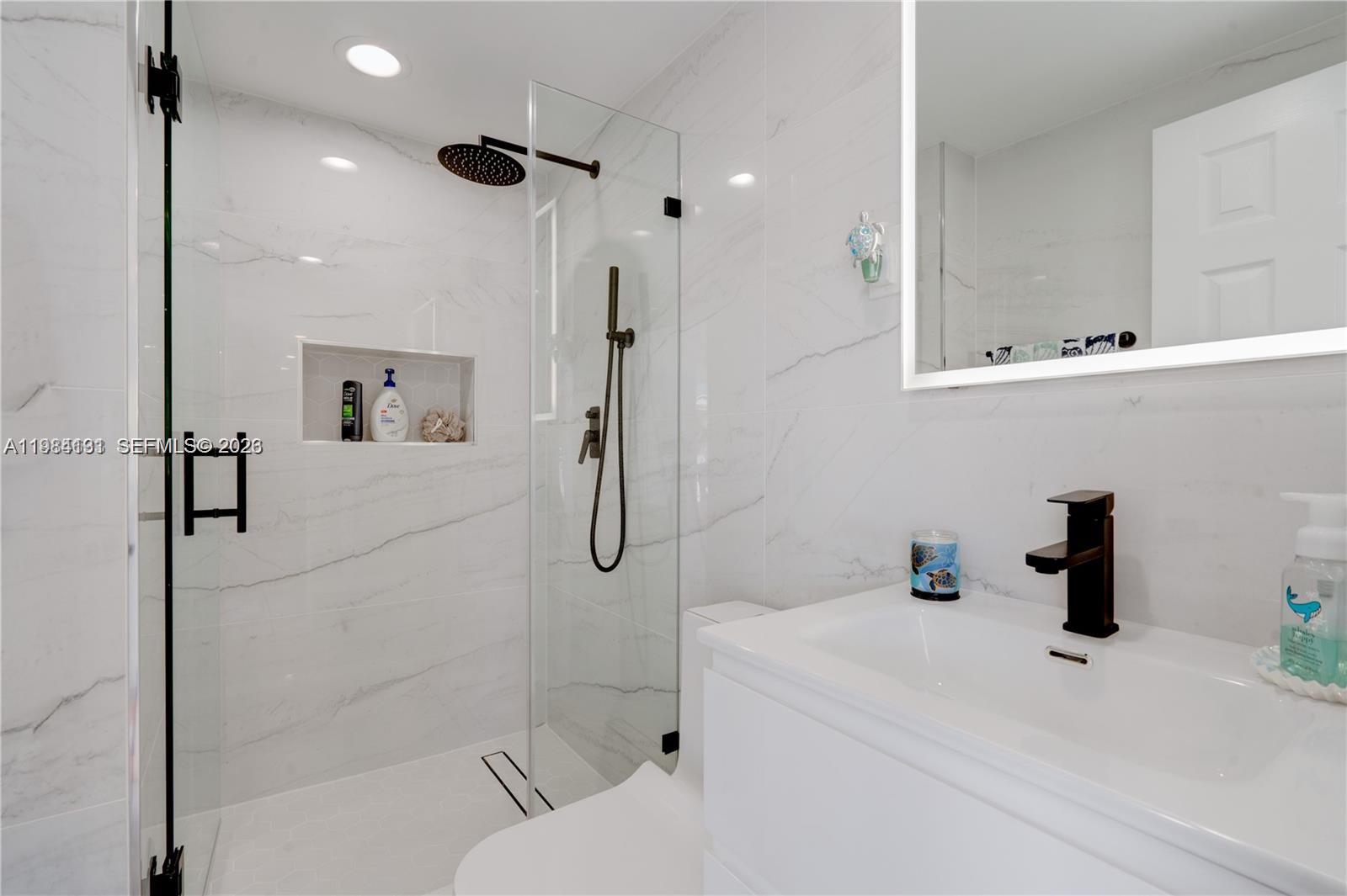 48 Andros Road Key Largo, FL 33037 - Photo 59 of 59 a bathroom with a sink a toilet and shower