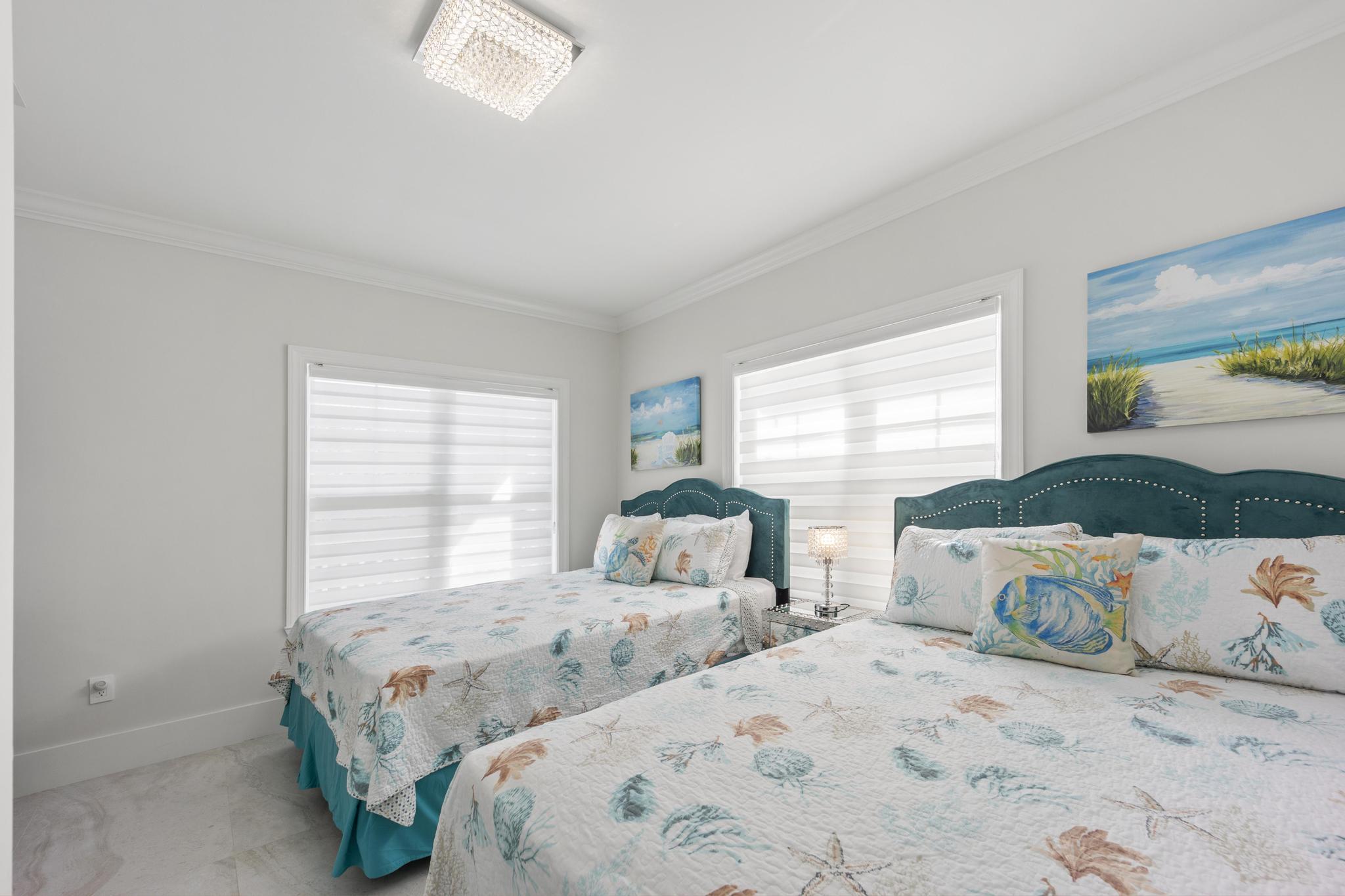 7213 Simran Lane Marathon, FL 33050 - Photo 17 of 40 a bedroom with two beds and a large window