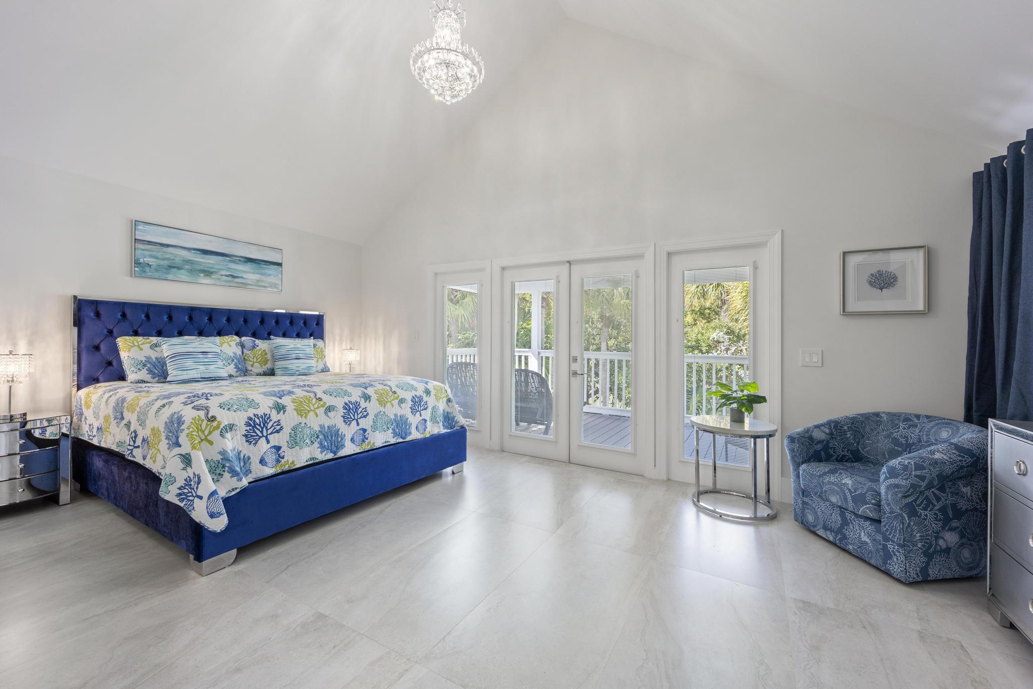 7213 Simran Lane Marathon, FL 33050 - Photo 18 of 40 a bedroom with a large bed and a large window