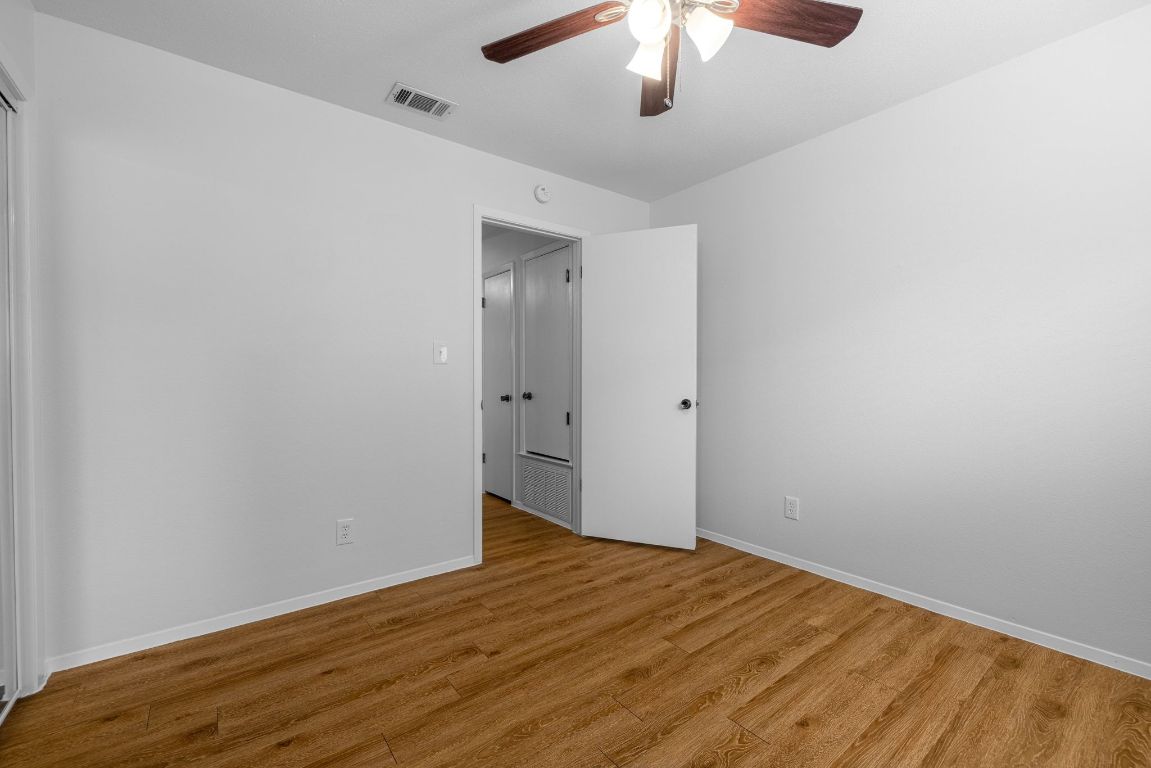 12801 Copper Cliff Avenue, Unit B Austin, TX 78727 - Photo 19 of 23 wooden floor in an empty room