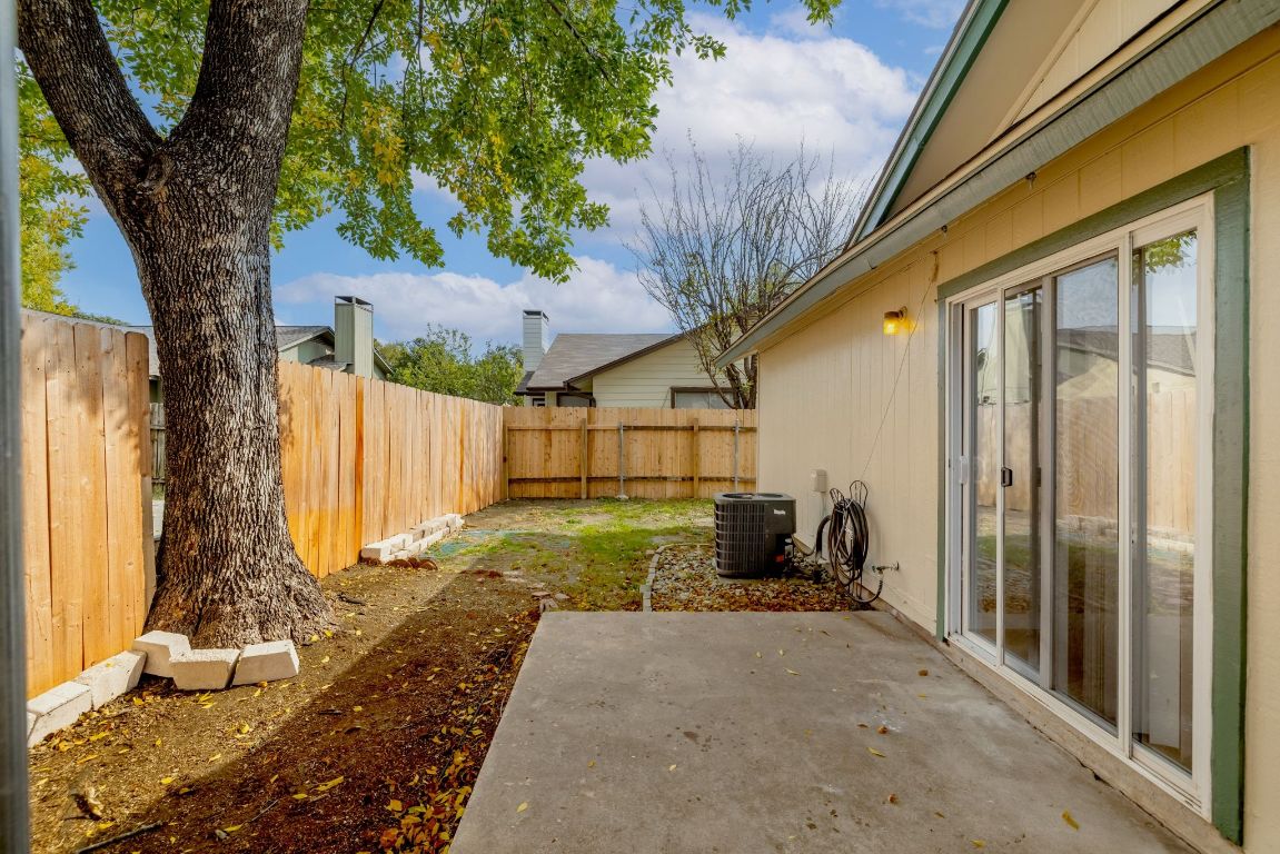 12801 Copper Cliff Avenue, Unit B Austin, TX 78727 - Photo 23 of 23 a view of a backyard