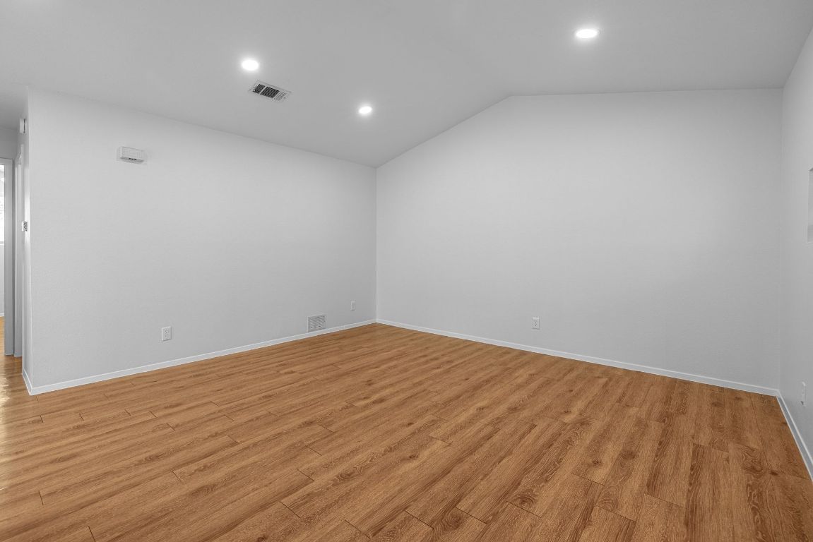 12801 Copper Cliff Avenue, Unit B Austin, TX 78727 - Photo 4 of 23 a view of empty room with wooden floor
