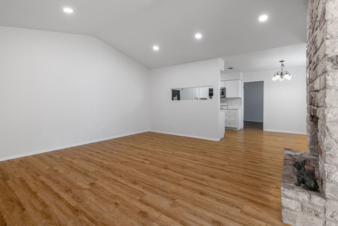 12801 Copper Cliff Avenue, Unit B Austin, TX 78727 - Photo 5 of 23 a view of a kitchen with wooden floor
