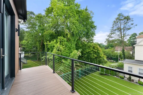 a bathroom with a bathtub a sink and a mirror