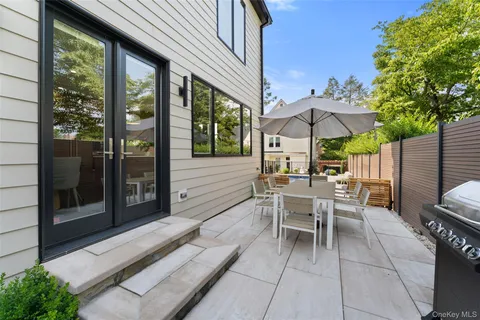 a view of a patio in the backyard