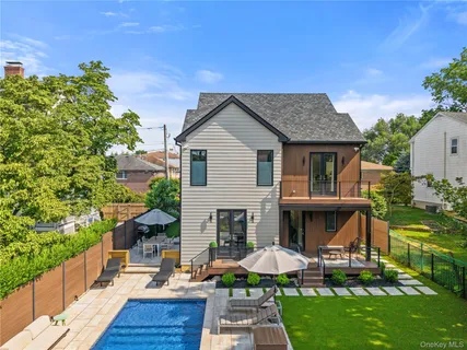 a view of patio with a table and chairs under an umbrella