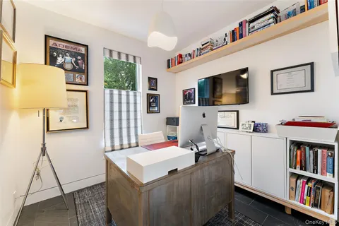 a large kitchen with a table and chairs