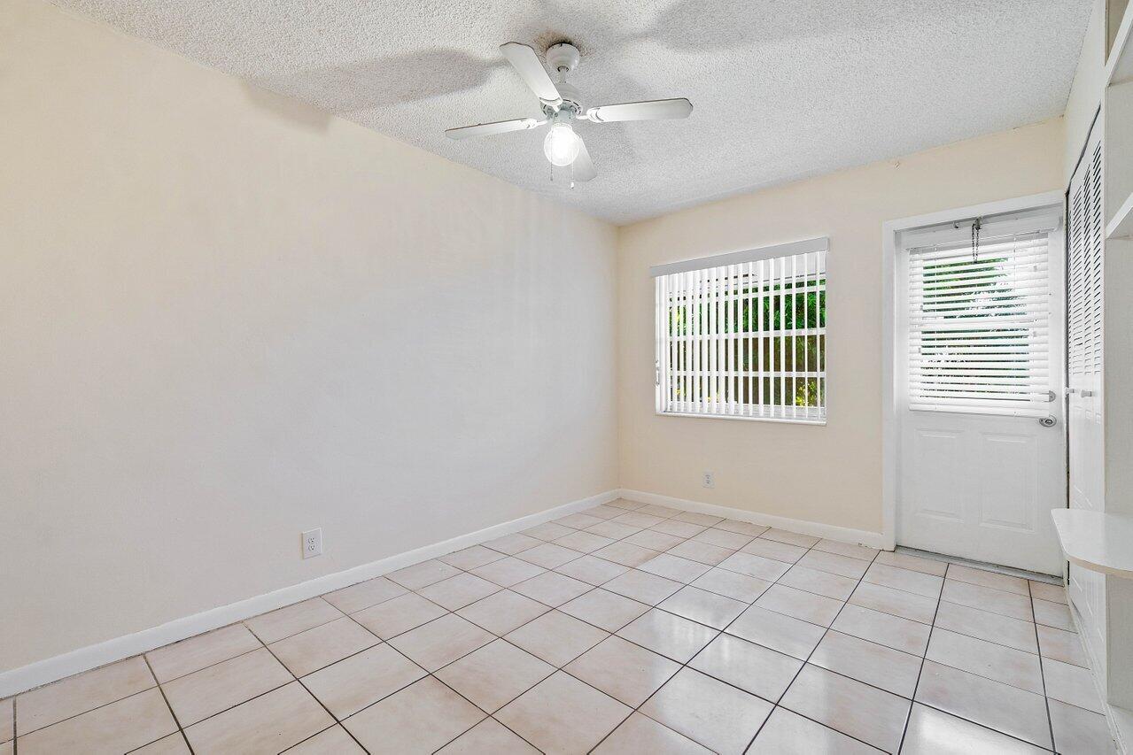 701 Pine Drive, Unit 210 Pompano Beach, FL 33060 - Photo 11 of 20 a view of an empty room with a window