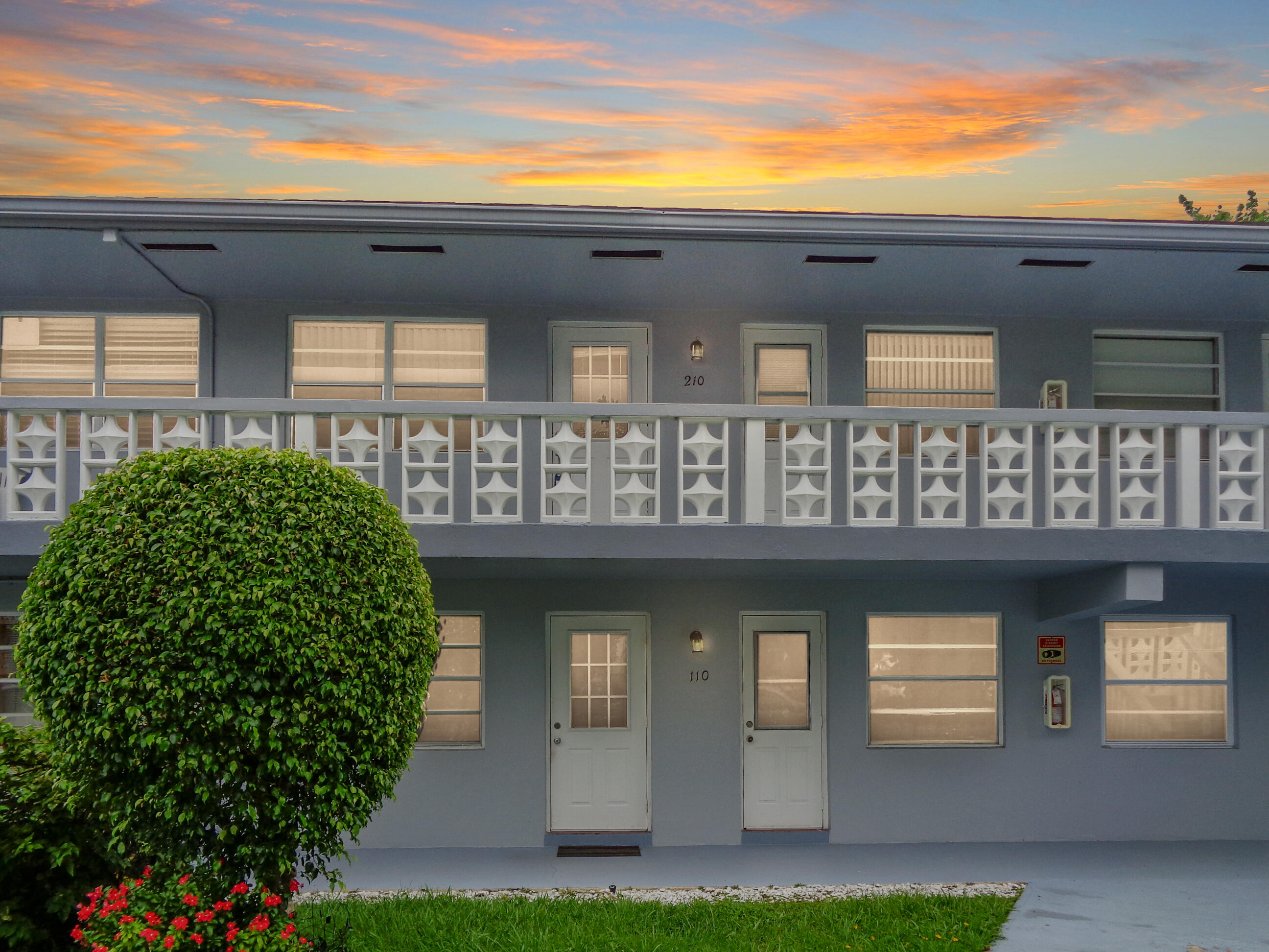 701 Pine Drive, Unit 210 Pompano Beach, FL 33060 - Photo 18 of 20 a front view of a house with a yard