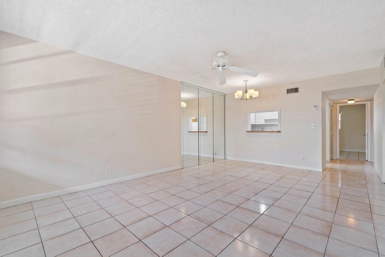 701 Pine Drive, Unit 210 Pompano Beach, FL 33060 - Photo 6 of 20 a view of an empty room and window