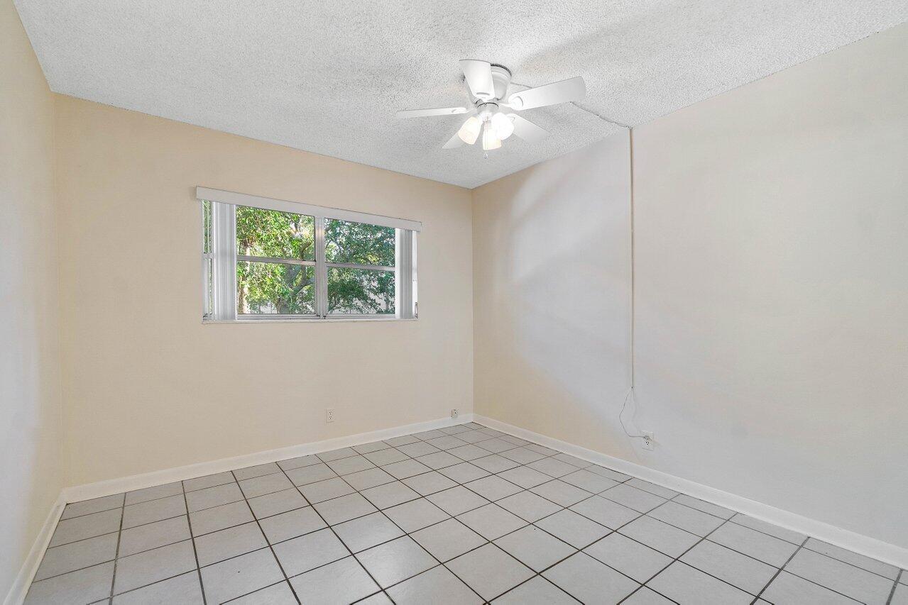 701 Pine Drive, Unit 210 Pompano Beach, FL 33060 - Photo 9 of 20 a view of an empty room and window