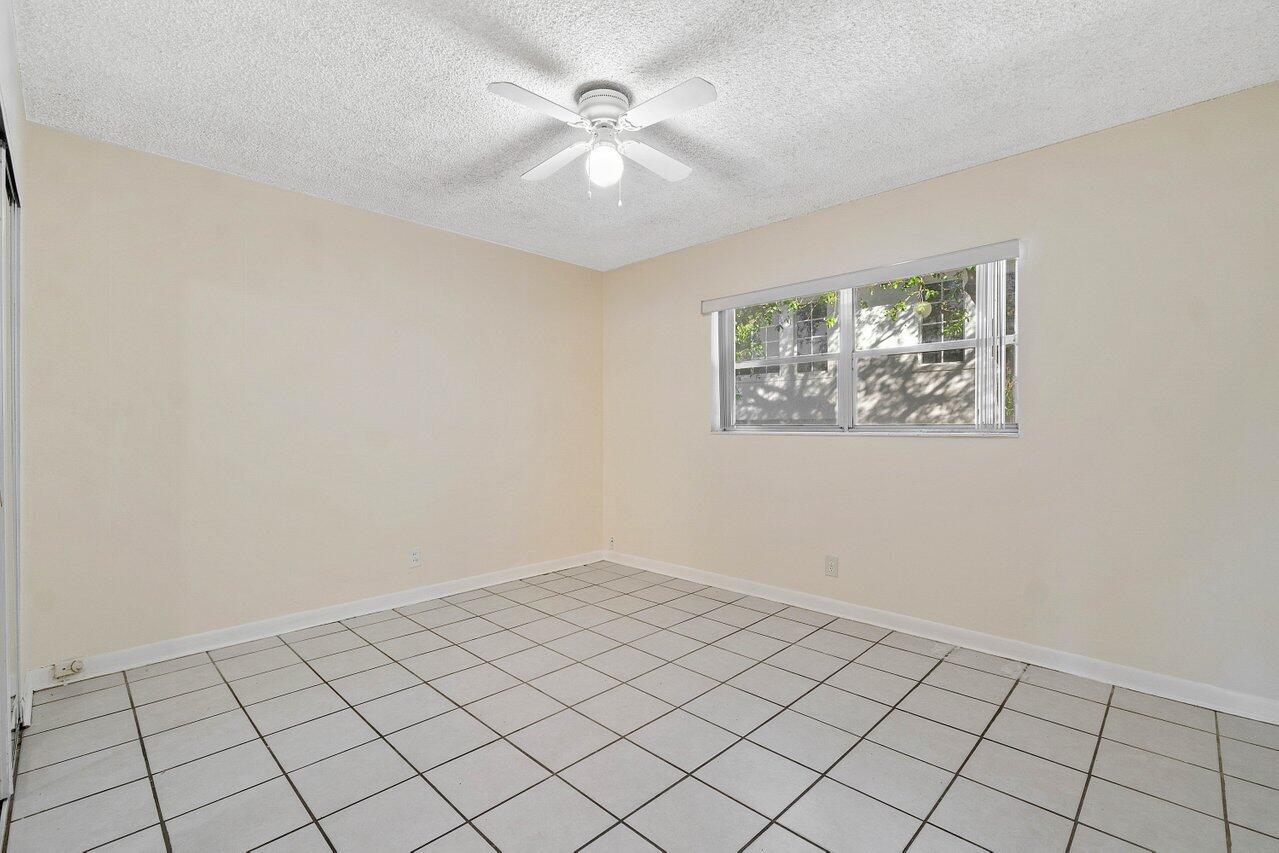 701 Pine Drive, Unit 210 Pompano Beach, FL 33060 - Photo 10 of 20 a view of an empty room and window