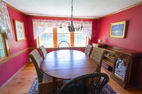 347 North Road Sudbury, MA 01776 - Photo 12 of 27 a view of a dining room with furniture a chandelier and wooden floor