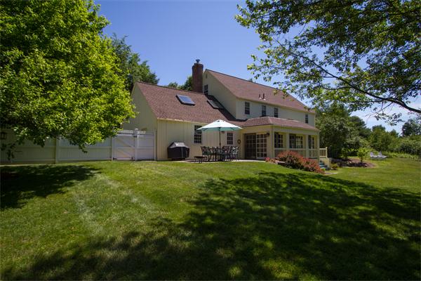 347 North Road Sudbury, MA 01776 - Photo 2 of 27 a front view of a house with a garden