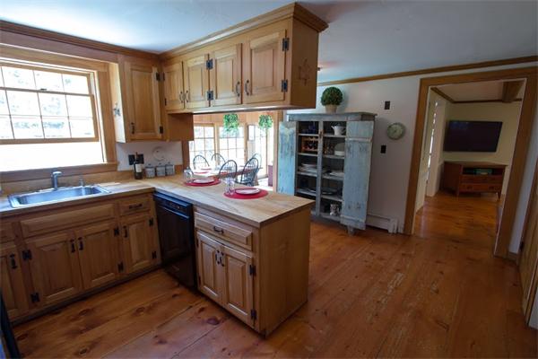 347 North Road Sudbury, MA 01776 - Photo 6 of 27 a kitchen with stainless steel appliances granite countertop a stove and a refrigerator