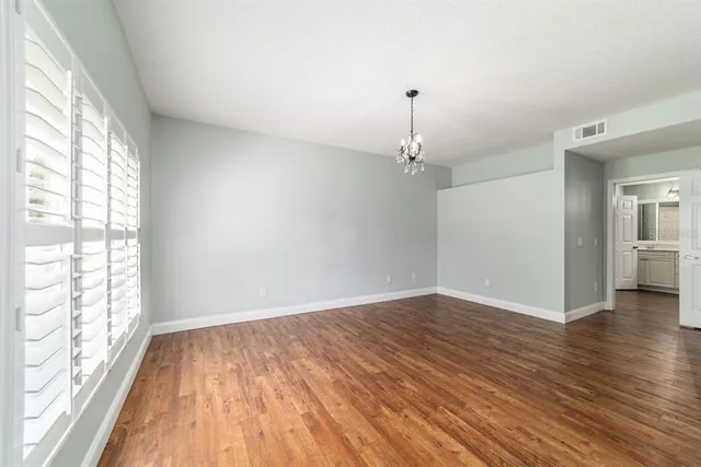 a bathroom with a double vanity sink and mirror