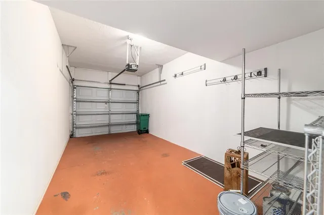 a view of a house with a big yard and large trees