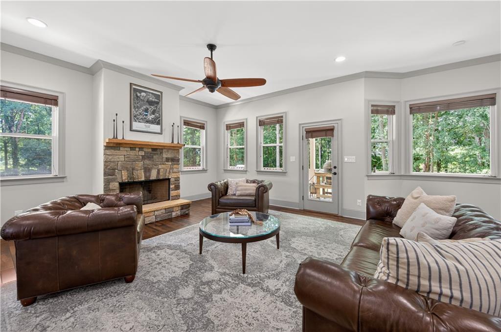 632 Geiger Road Jefferson, GA 30549 - Photo 14 of 55 a living room with furniture a fireplace and a large window