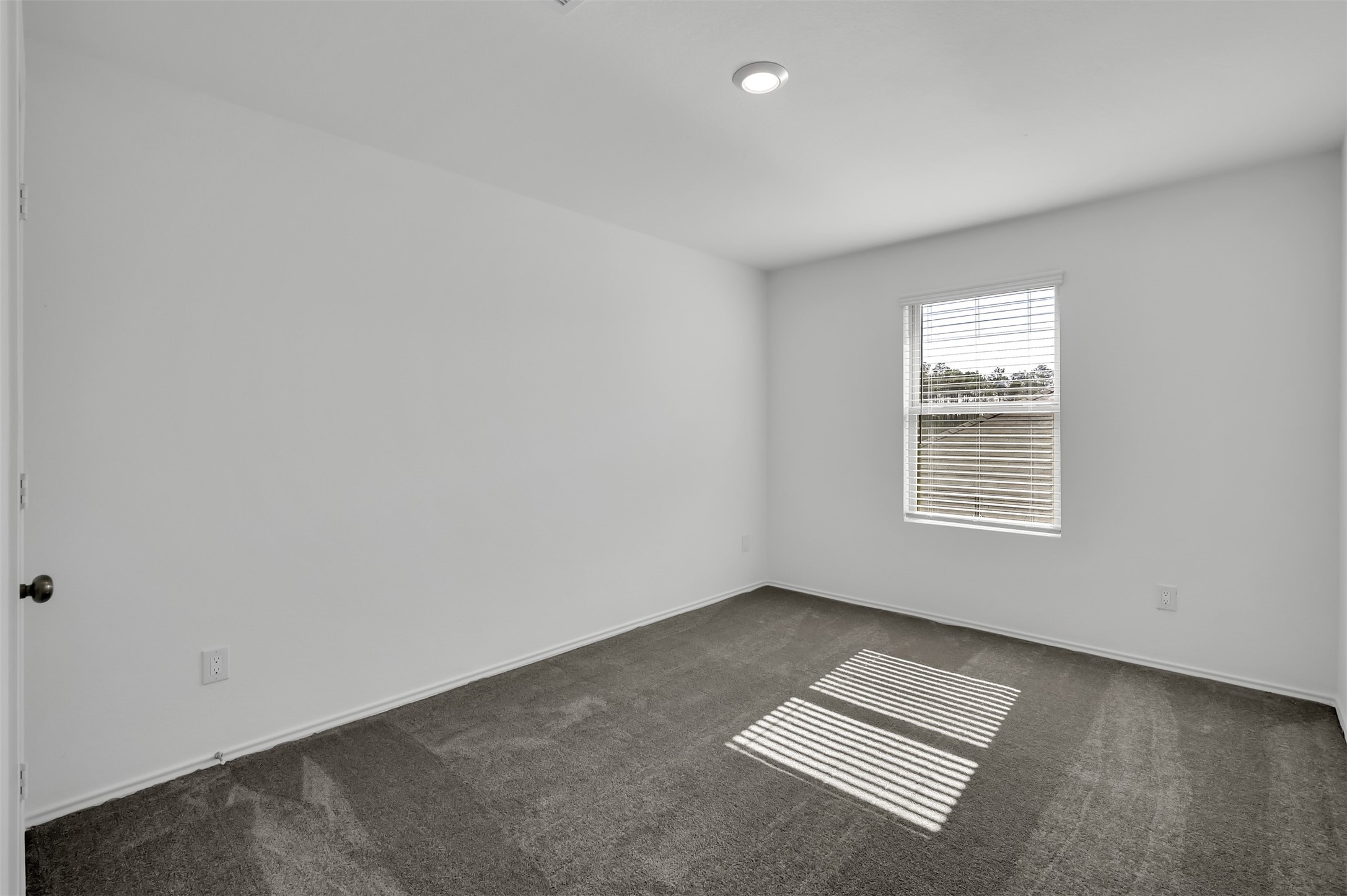 3647 Solanum Drive Conroe, TX 77301 - Photo 14 of 17 an empty room with windows