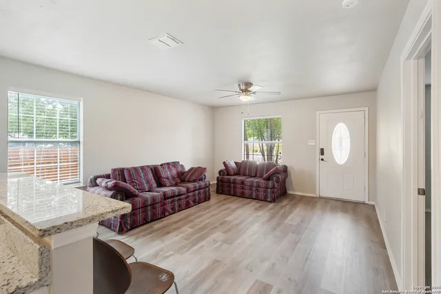 a living room with furniture and a window