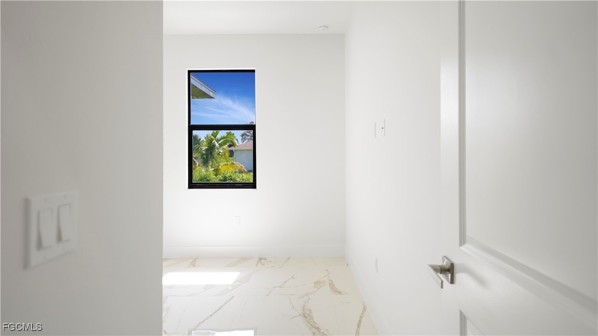 121 Ichabod Avenue Lehigh Acres, FL 33973 - Photo 27 of 42 a view of a hallway