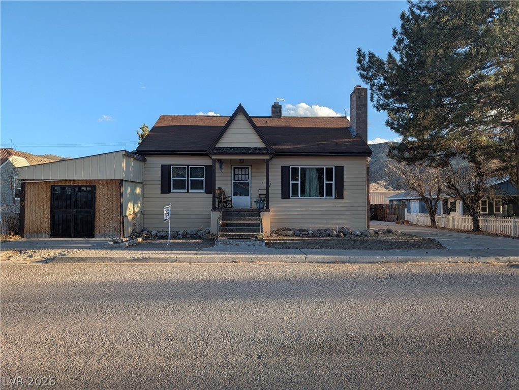 561 Main Street Caliente, NV 89008 - Photo 3 of 33 Bungalow-style house featuring a chimney and covered porch