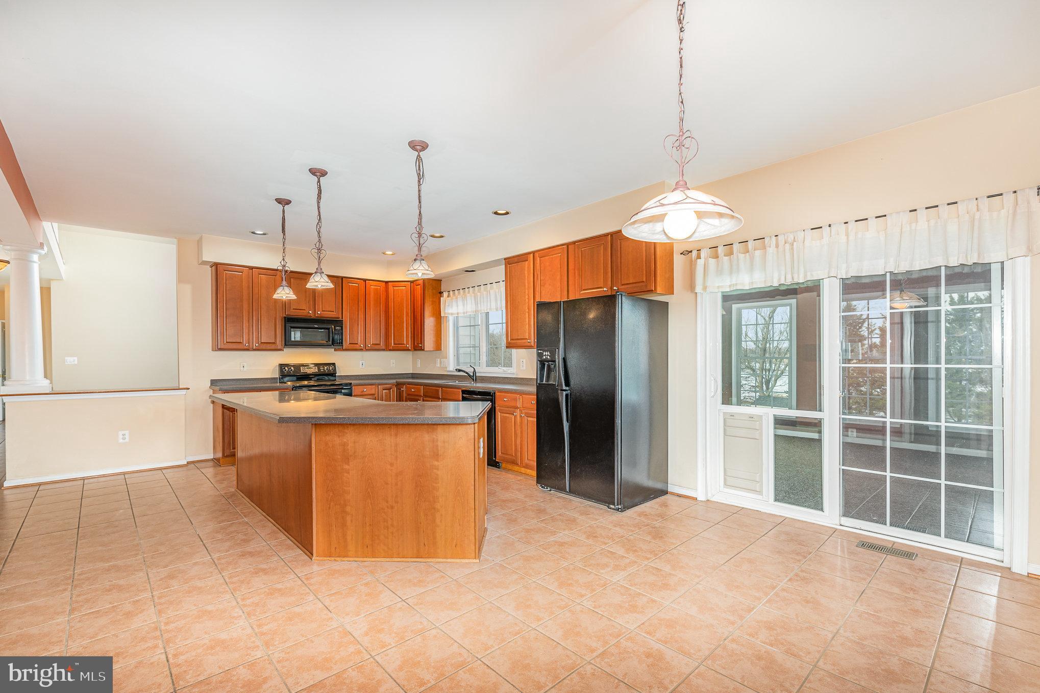 3 Ailsa Court Rising Sun, MD 21911 - Photo 13 of 48 a kitchen with stainless steel appliances granite countertop a refrigerator a sink a stove and a wooden floors