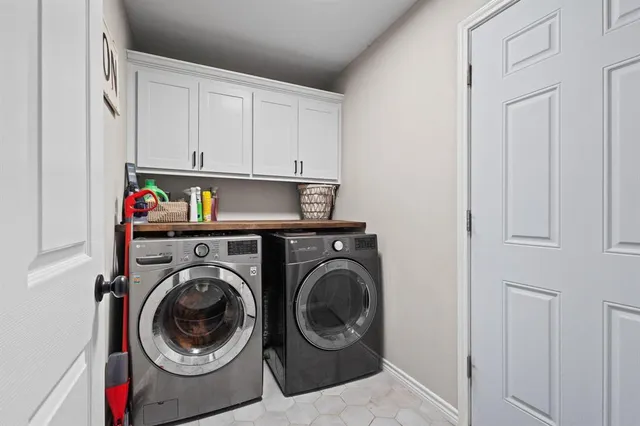 a utility room with dryer and washer