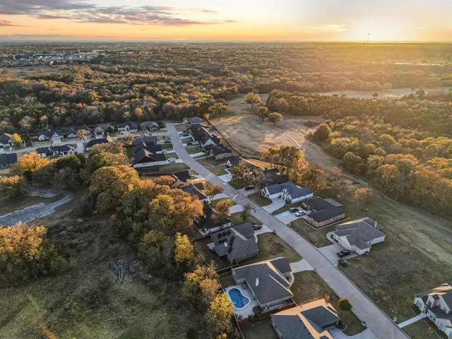 an aerial view of residential building with parking space