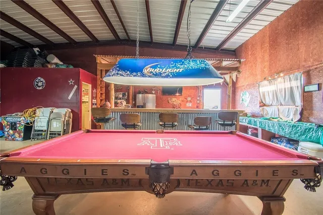 a bathroom with a toilet and a shower curtain