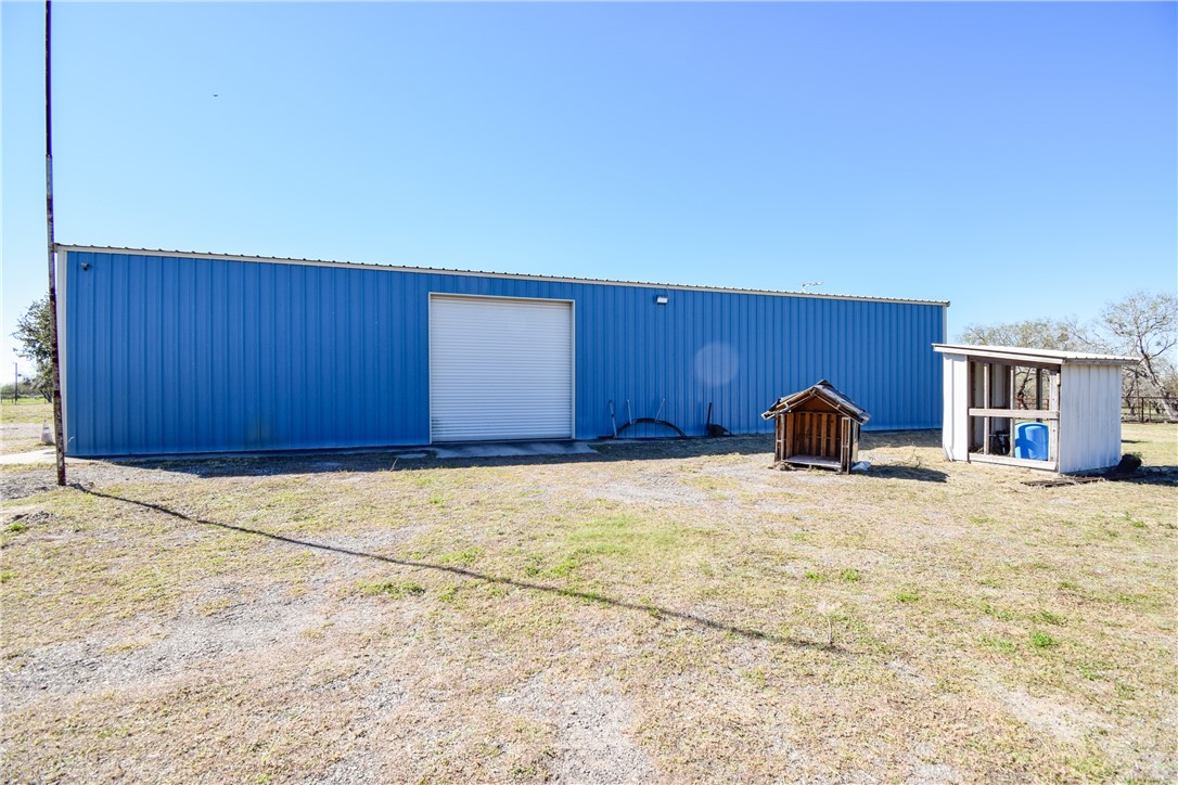 23250 County Road 1038 Mathis, TX 78368 - Photo 28 of 40 a view of empty room with a door and wooden floor