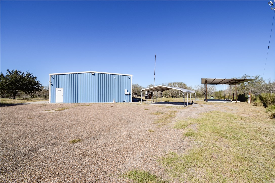 23250 County Road 1038 Mathis, TX 78368 - Photo 7 of 40 a view of a house with a yard