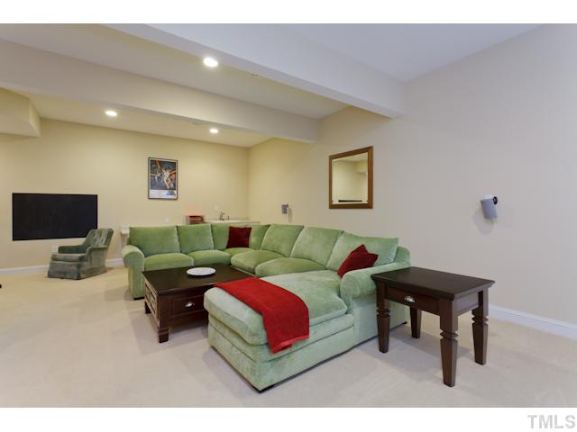 7613 Double E Court Raleigh, NC 27613 - Photo 12 of 23 a living room with furniture and a flat screen tv