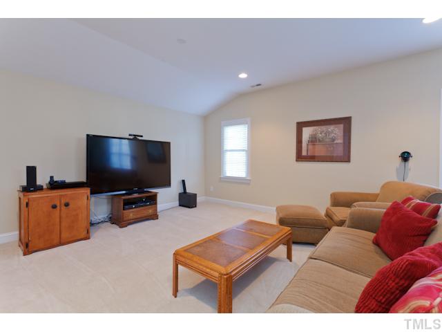7613 Double E Court Raleigh, NC 27613 - Photo 14 of 23 a living room with furniture and a flat screen tv