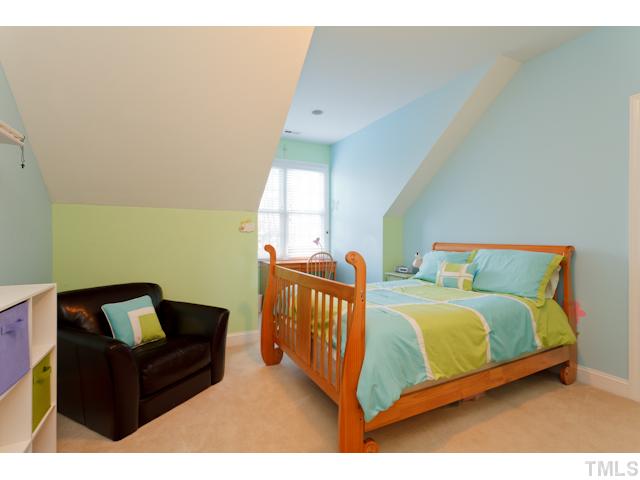 7613 Double E Court Raleigh, NC 27613 - Photo 17 of 23 a bedroom with two beds and a couch