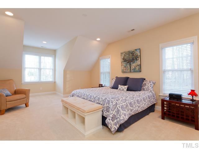 7613 Double E Court Raleigh, NC 27613 - Photo 18 of 23 a bedroom with a bed window and couch