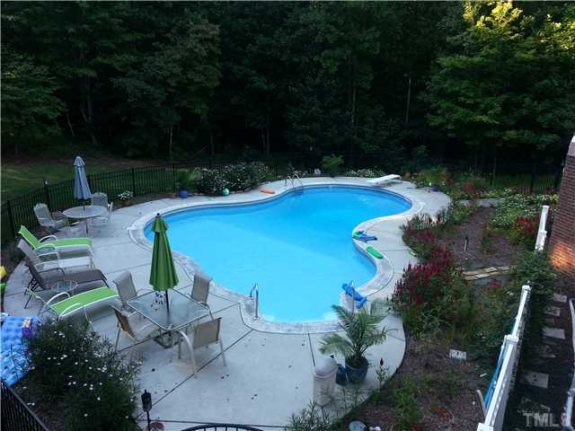 7613 Double E Court Raleigh, NC 27613 - Photo 22 of 23 an aerial view of a house with garden space and lake view
