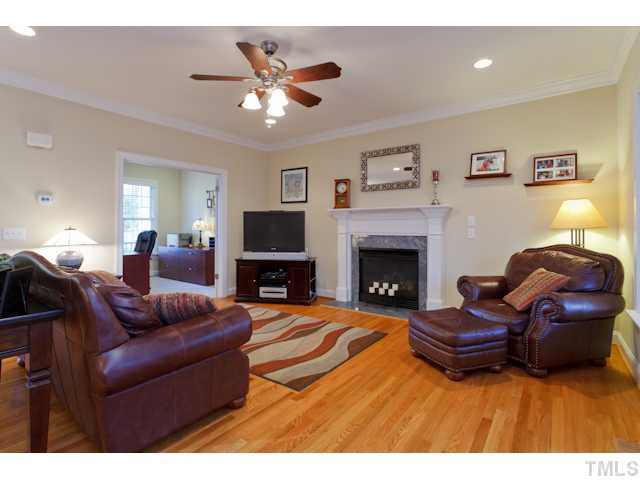 7613 Double E Court Raleigh, NC 27613 - Photo 4 of 23 a living room with furniture and a fireplace