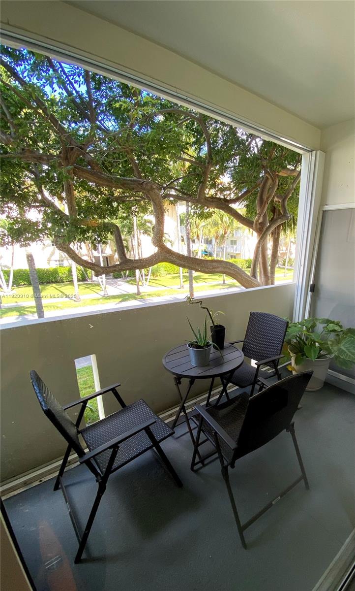 300 Galen Drive, Unit 205 Key Biscayne, FL 33149 - Photo 8 of 20 a workspace with furniture and a window