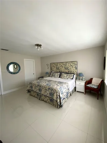 a bedroom with a bed and a table