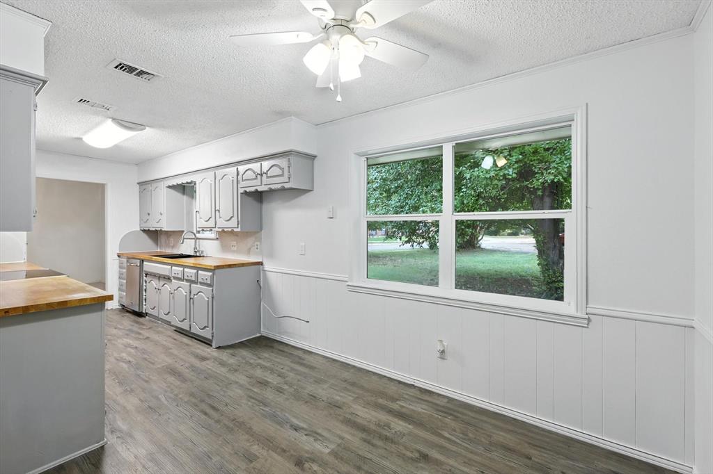 3300 Dunes Street Denton, TX 76209 - Photo 18 of 40 a kitchen with a stove a sink and a window