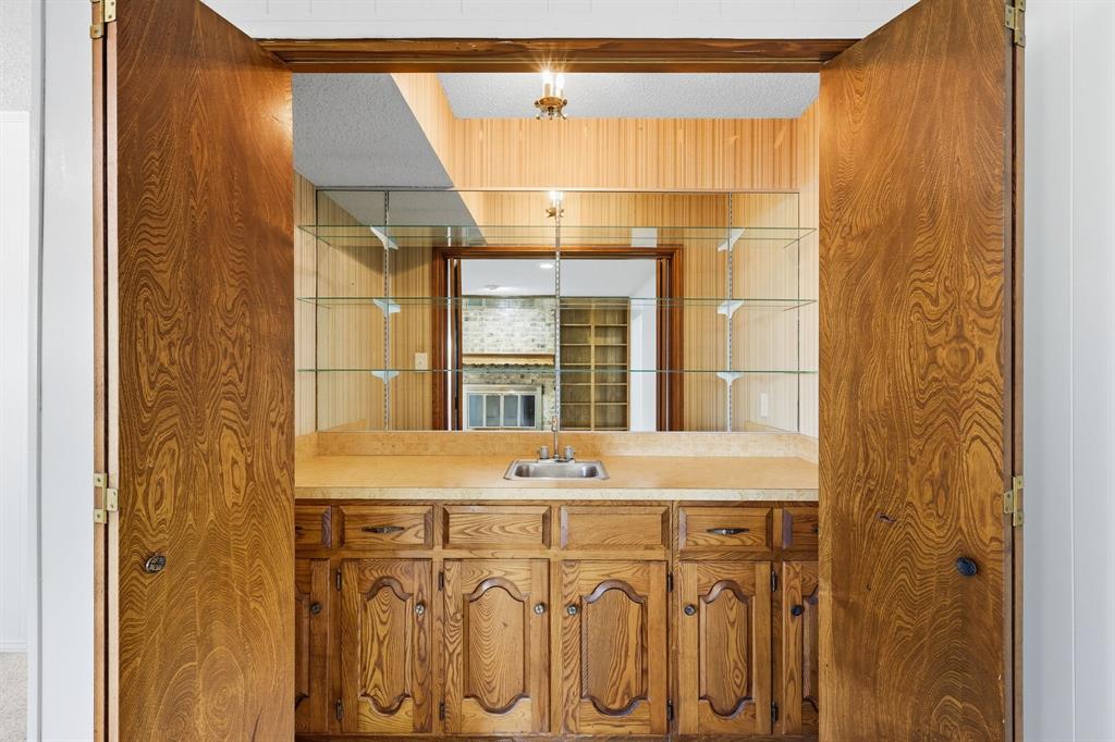 3300 Dunes Street Denton, TX 76209 - Photo 23 of 40 a bathroom with a sink and a mirror