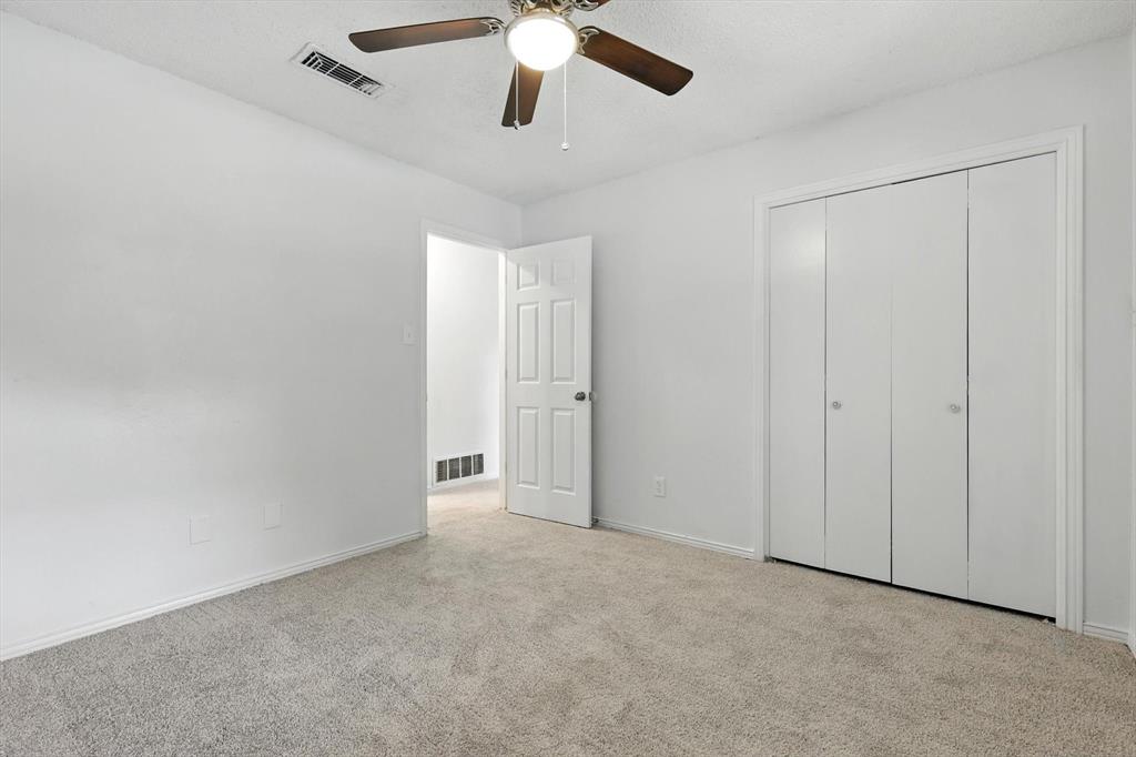 3300 Dunes Street Denton, TX 76209 - Photo 25 of 40 an empty room with chandelier fan